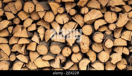Wooden logs, beams, firewood, frame. Wooden log wooden background. fuel. Harvesting firewood for the winter. Concept: fuel, texture Stock Photo