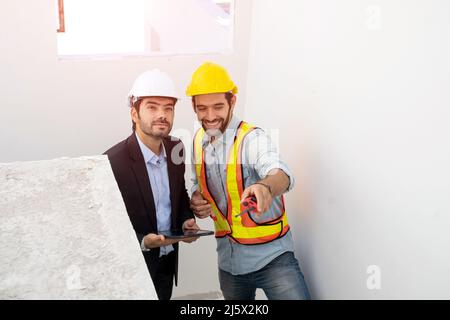 Engineer team work planning in construction site,Construction Contractors building a new home. Stock Photo