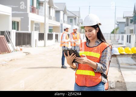 Engineers and architect discussion for plans for new home and working on a building site,Architecture concept. Stock Photo