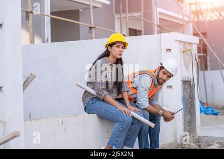 Engineer and architect are stressed at construction site,He is having problems in work,Engineering concept. Stock Photo