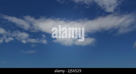 Blue sky with white fluffy clouds used as a background or texture Stock Photo