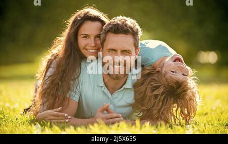 mom dad and son love relax together. adoption and charity. family day. friendship. Stock Photo