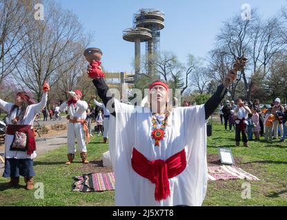 Dancers from the Calpulli Mexican Dance Group march, dance, celebrate & give gratitude at the anniversary of Esculeita en Casa. In Queens, NYC. Stock Photo