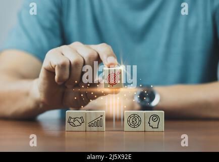 Hand arranging wood block with arrow up icon. Business concept growth ...