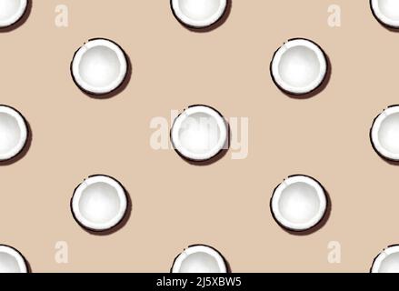 Fresh cut coconuts on beige background. Top view. Stock Photo