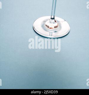 Wine glass base on blue background. Stock Photo