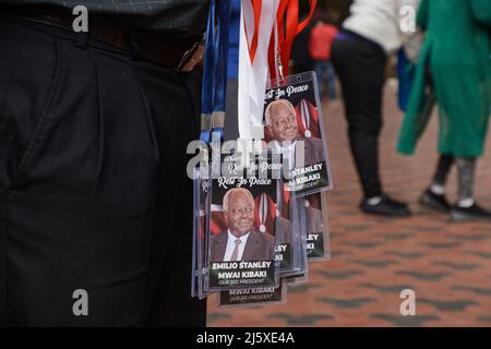 Nairobi, Kenya. 25th Apr, 2022. A vendor sells tags bearing the image of the late president of Kenya Mwai Kibaki outside the Parliament Building. The former head of state, who ruled for eight years (December 2002 until April 2013) died on April 22, 2022 as announced by the current president Uhuru Kenyatta. Credit: SOPA Images Limited/Alamy Live News Stock Photo