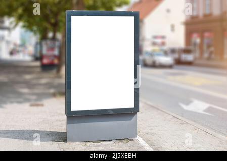 Blank city billboard, led light mockup. Isolated poster in white for advert presentation. Street with cars in background Stock Photo