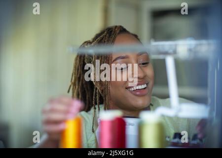 Happy young female seamstress Stock Photo