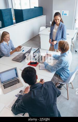 Business people collaborating on a new project. Stock Photo