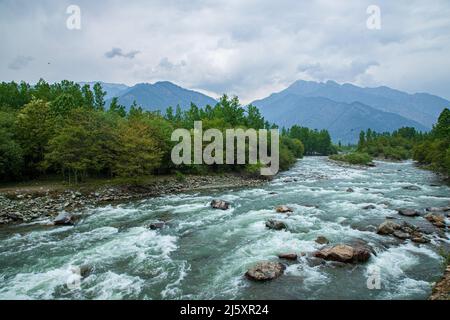 Srinagar, India. 24th Apr, 2022. General view of Lidder river in the backdrop of mountains in Pahalgam a famous tourist destination in the Himalayan region's Indian Administered Kashmir. River rafting in Kashmir especially in Lidder Valley at Pahalgam has emerged as one of the most popular adventure sports. Some of the top tourist destinations in Kashmir like Pahalgam and Sonmarg offer an ideal place for river rafting. (Photo by Faisal Bashir/SOPA Images/Sipa USA) Credit: Sipa USA/Alamy Live News Stock Photo