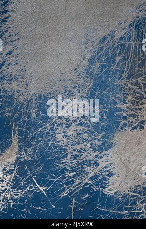 Blue and white cement wall with scratches and cracks background texture Stock Photo