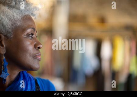Close up profile portrait thoughtful senior woman Stock Photo