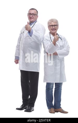 in full growth. two medical colleagues showing thumbs up. isolated on a white background Stock Photo