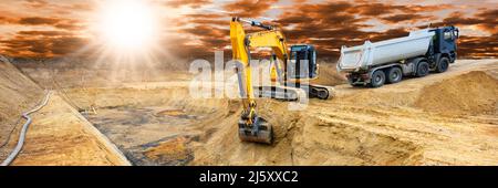 excavator digging on construction site Stock Photo