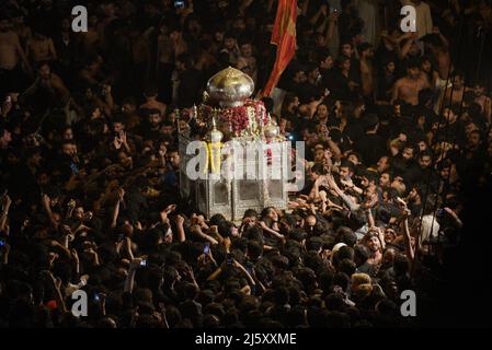 Lahore, Pakistan. 23rd Apr, 2022. (4/23/2022) Pakistani Shiite Muslims are participating in the mourning procession during the day of martyrdom of Hazrat Ali Al-Murtaza (A.S) from Bhati Gate to Imambargah Karbala Gamay Shah in Lahore. Shiite Muslims from all over the world are holding mourning procession on the occasion of Youm-e-Ali (A.S), the day of martyrdom 21st Ramadan. a procession to commemorate the 7th century killing of Imam Ali during the holy fasting month of Ramadan al Mubarak. (Photo by Rana Sajid Hussain/Pacific Press/Sipa USA) Credit: Sipa USA/Alamy Live News Stock Photo