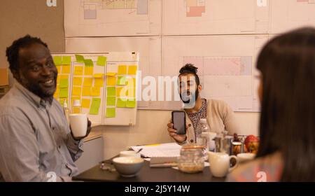 Architects talking in conference room meeting Stock Photo