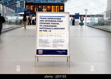 London, UK. 26th Apr, 2022. Sign offering free onward travel to Ukraine refugees by train operators at Waterloo Station. Credit: JOHNNY ARMSTEAD/Alamy Live News Stock Photo