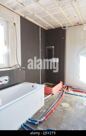 Interior design of the bathroom with bathtub in bathroom construction or bathroom renovation in a family home Stock Photo