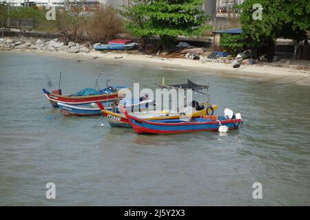 GEORGE TOWN, MALASIA – JANUARY 29, 2020 long tailed boats moored next to the beach Stock Photo
