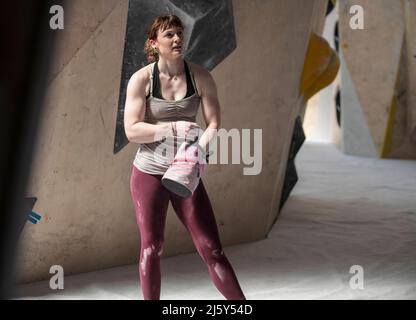 Young female rock climber with chalk bag Stock Photo