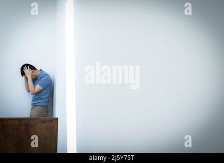 Frustrated businessman with head in hands Stock Photo