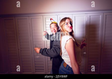Portrait playful, silly couple in costumes Stock Photo
