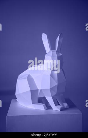 very peri rabbit made of paper in the papercraft technique. Easter Stock Photo