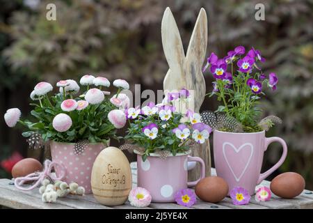 easter decoration with pink spring flowers, eggs and easter bunny Stock Photo