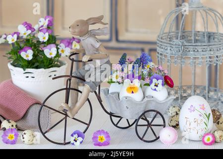easter decoration with easter bunny and spring flowers in eggs Stock Photo