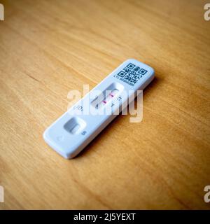 A positive Covid-19 Lateral Flow test kit, UK. Stock Photo