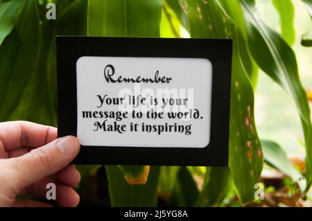 Motivational quote text on notepad - Your life is your message to the world. Make it inspiring. Motivational concept Stock Photo