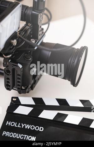 Modern black mirrorless camera rig and clapperboard Stock Photo