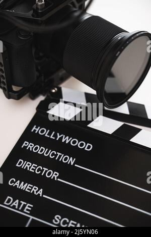 Modern black mirrorless camera rig and clapperboard Stock Photo