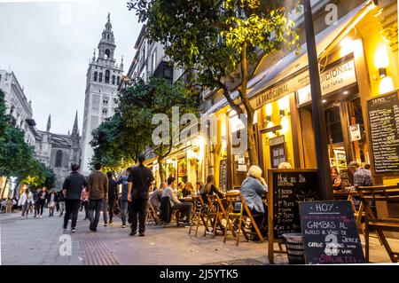 La Tradicional tapas bar with outdoor terrace in C. Mateos Gago, Sevilla, Spain. Evening stroll near Catedral de Seville Stock Photo