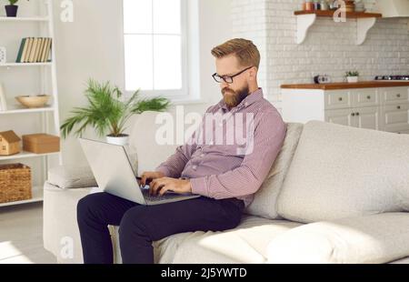 Middle-aged businessman work on computer at home office Stock Photo