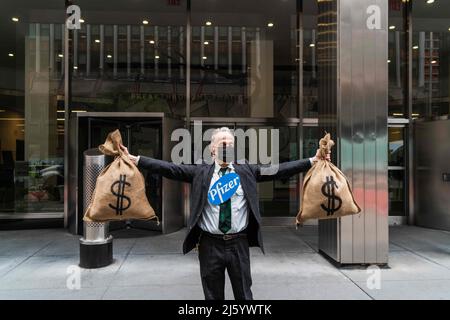 April 25, 2022, New York City, New York, United States: A staged visual action of money heist at Pfizer's Manhattan Headquarters in New York City was held to highlight Pfizer's failure to address inequitable access to it's .Covid-19 vaccine and treatment. Activists claim that Pfizer while making billions of dollars by perpetuating vaccine and treatment scarcity even as people in low and middle income countries suffer sickness and death due to a lack of access. (Credit Image: © Steve Sanchez/Pacific Press via ZUMA Press Wire) Stock Photo