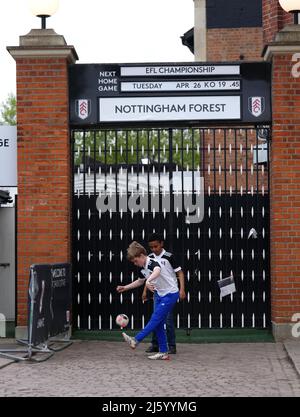 Young Fulham fans play football outside the ground before the Sky Bet Championship match at Craven Cottage, London. Picture date: Tuesday April 26, 2022. Stock Photo