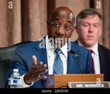 Washington, United States. 26th Apr, 2022. U.S. Senator Raphael Warnock (D-GA) speaking at a hearing of the Senate Banking, Housing, and Urban Affairs committee. Credit: SOPA Images Limited/Alamy Live News Stock Photo