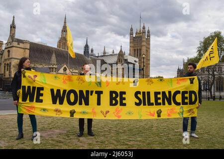 London, England, UK. 26th Apr, 2022. Protesters hold a banner which reads 'We won't be silenced'. Kill The Bill demonstrators gathered in Parliament Square in protest against the Police, Crime, Sentencing and Courts Bill, and the Nationality and Borders Bill. (Credit Image: © Vuk Valcic/ZUMA Press Wire) Stock Photo