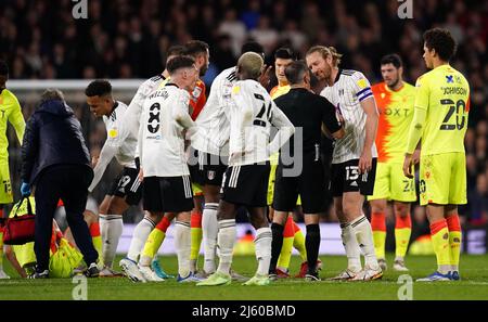 Fulham's Tim Ream (13) remonstrates with referee Keith Stroud after Nottingham Forest's Steve Cook goes to ground during the Sky Bet Championship match at Craven Cottage, London. Picture date: Tuesday April 26, 2022. Stock Photo