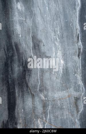 Old black, gray and white cement wall in Bali, Indonesia Stock Photo