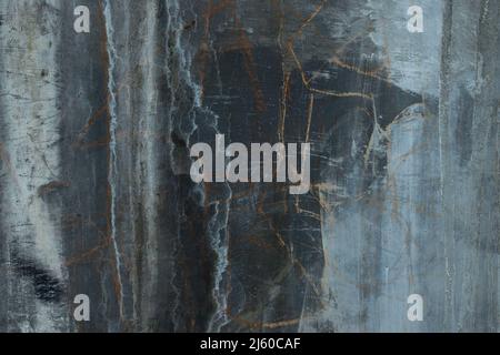 Old gray, white and black cement wall with cracks Stock Photo