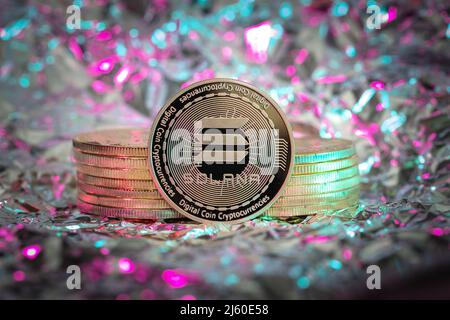 Solana SOL cryptocurrency physical coin, abstract background. Stock Photo