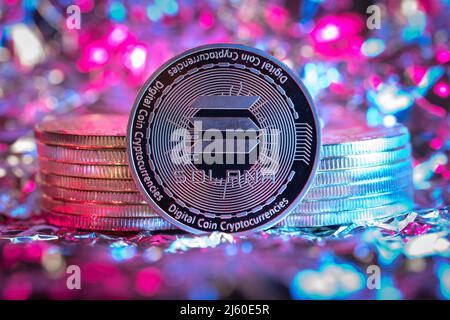 Solana SOL cryptocurrency physical coin, abstract background. Stock Photo