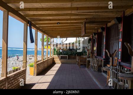 El Tunco, El Salvador - January 29, 2022: Patio of closed restaurant on the beach of El Tunco, El Salvador Stock Photo