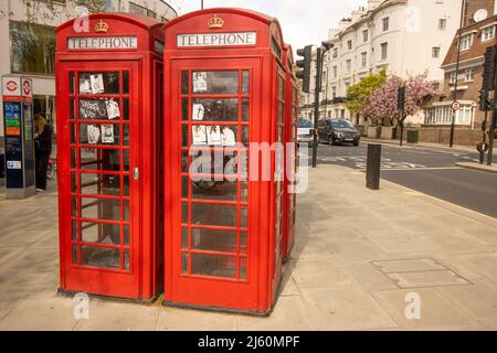 A group of four red Telephone boxes Stock Photo