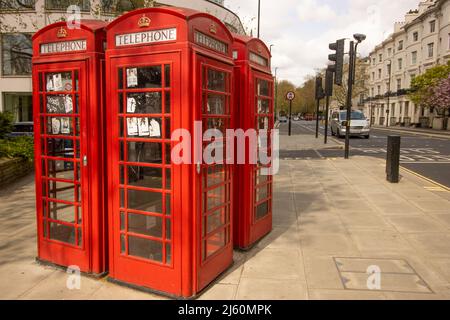 A group of four red Telephone boxes Stock Photo