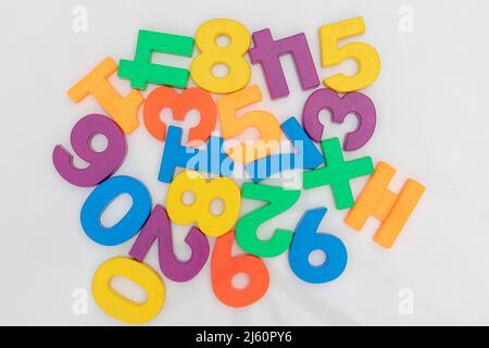 zero to nine plastic number set on a white background in random order Stock Photo