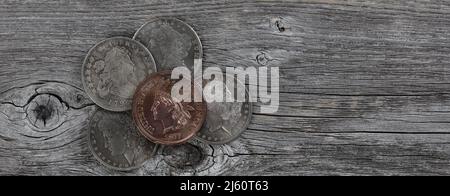 US American vintage coins on rustic wood in close up view Stock Photo